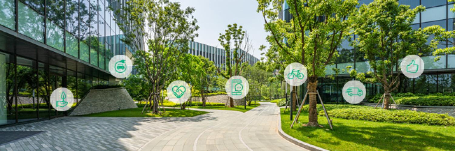 Bürokomplex mit viel Grünbepflanzung und runde Icon-Abbildungen zum Thema Mobilitätlösungen bei Arval
